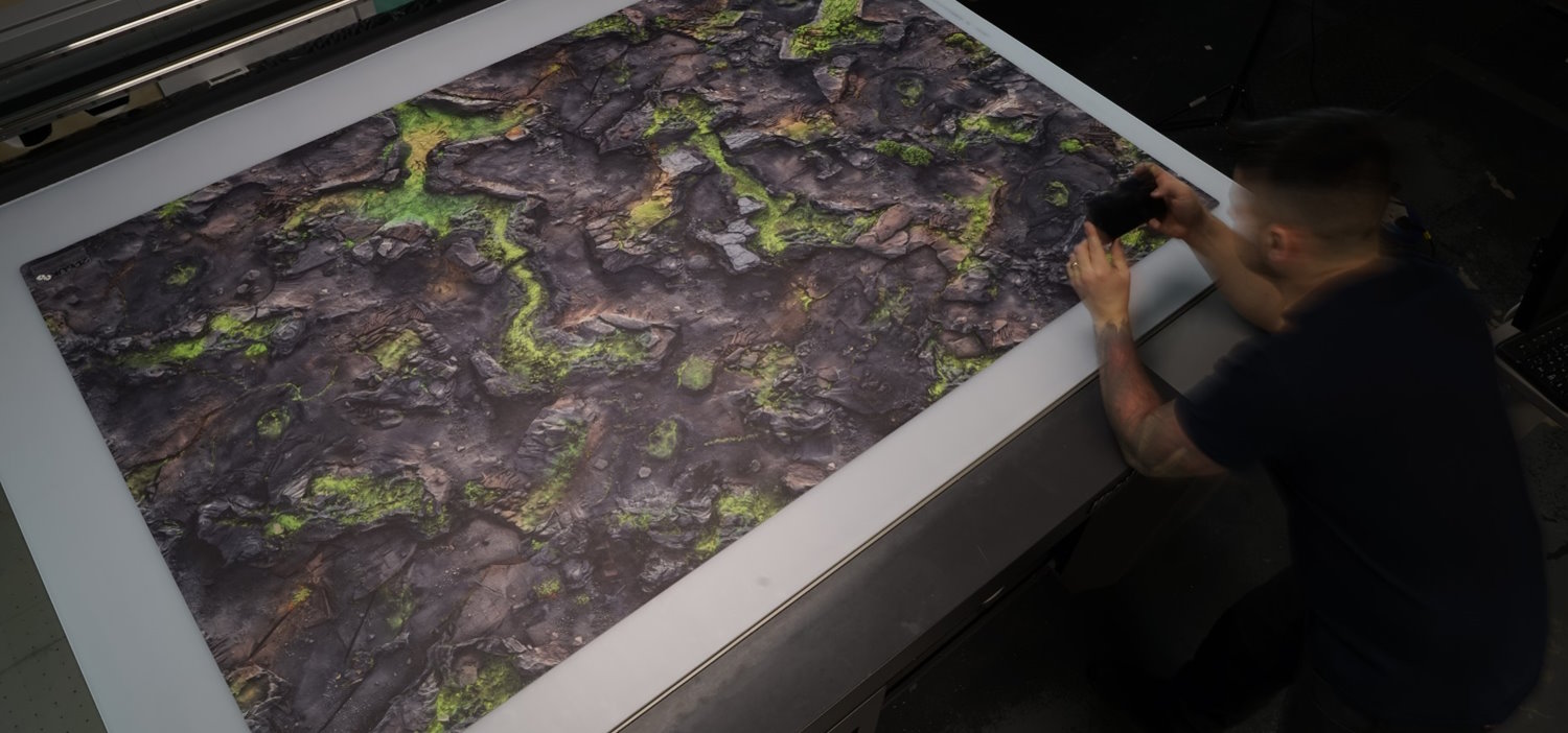 Mariusz checking a freshly printed 2D6 gaming mat