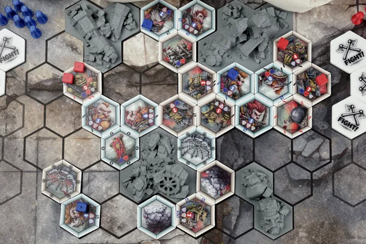 Hexfall game pieces arranged on the modular battlefield