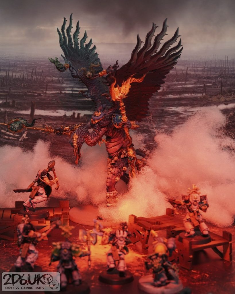 Winged daemon and armoured miniatures in a battle scene with red lighting and a devastated landscape backdrop